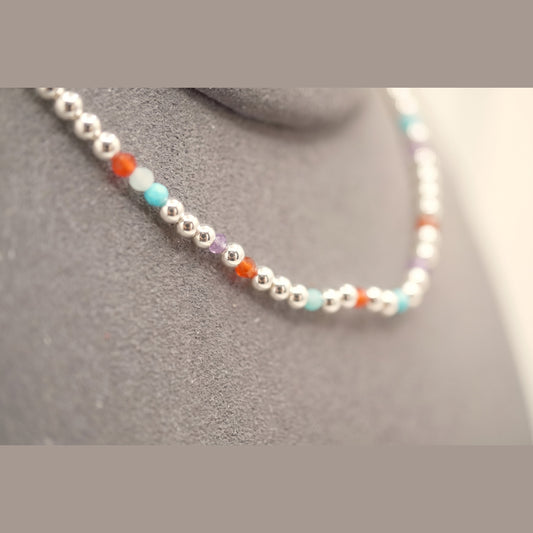 Macro of the Spider Silver Clasp DNA Profile Bracelet showing the 2mm silver spheres and gemstone markers
