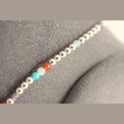 Close up of the Spider Silver Clasp DNA Profile Bracelet on the display stand