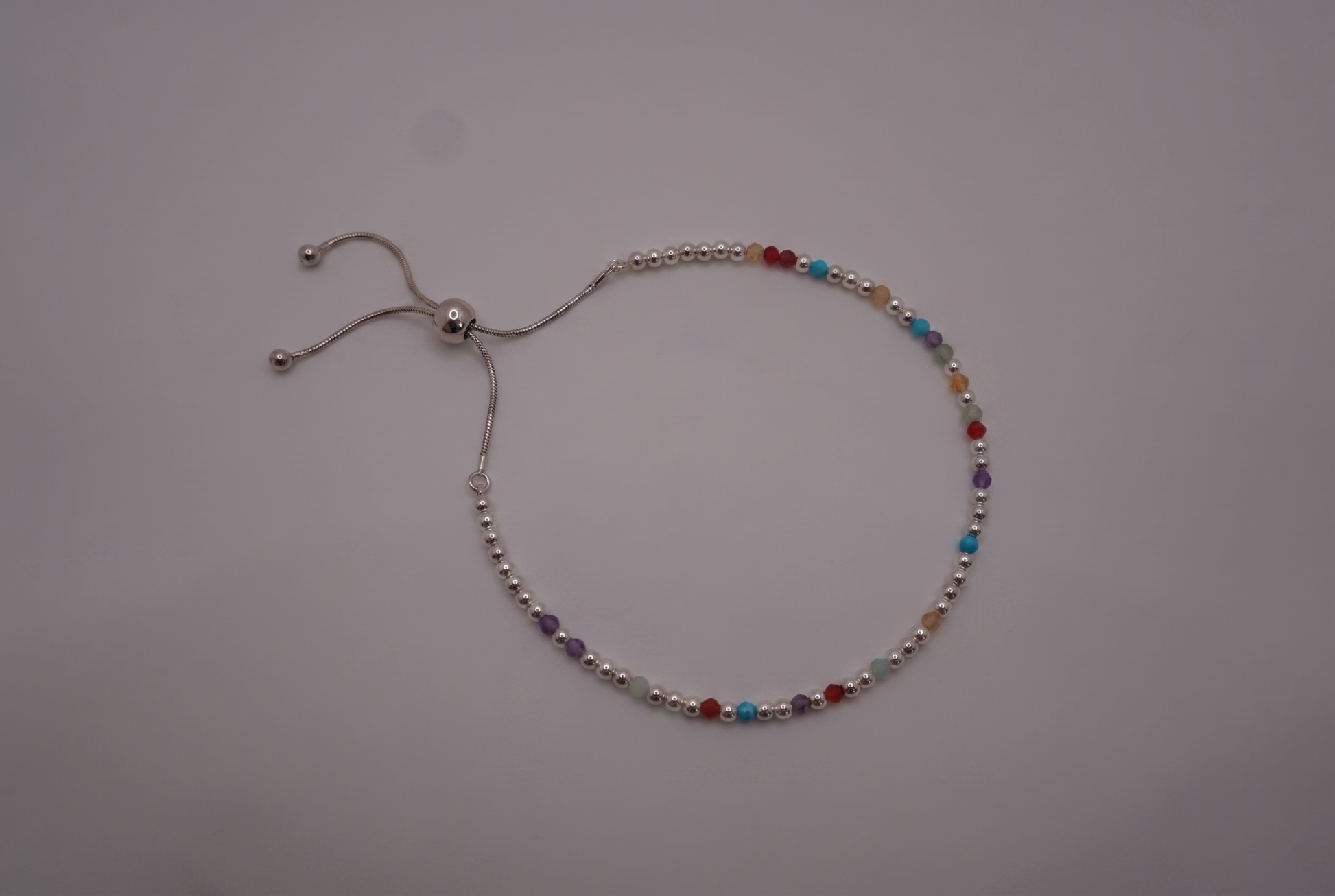 Spider Silver Clasp Bracelet with polished silver beads and gemstone markers, adjustable slider clasp
