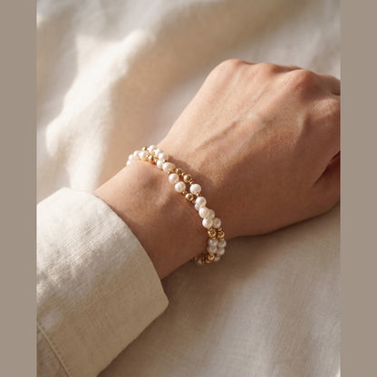 Twisted Pearl and Gold DNA Profile Bracelet worn on the wrist