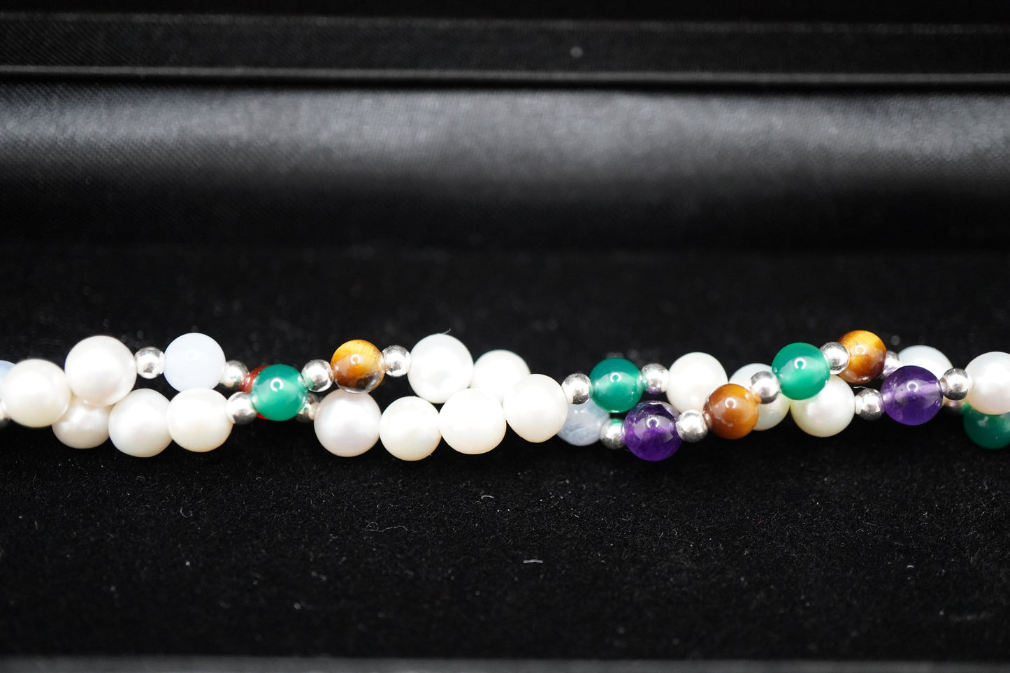 Macro of the Twisted Pearl Bracelet pearls, silver beads and gemstone markers