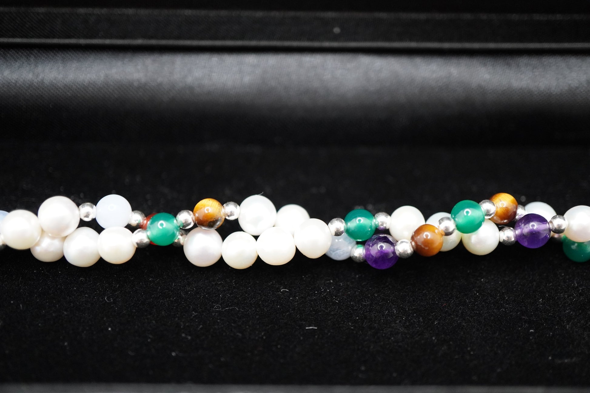 Macro of the Twisted Pearl Bracelet pearls, silver beads and gemstone markers