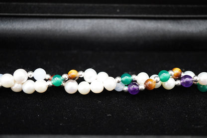 Macro of the Twisted Pearl Bracelet pearls, silver beads and gemstone markers
