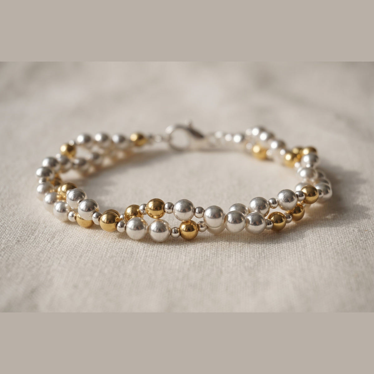 Twisted Silver and Gold DNA Profile Bracelet, silver sphere rope with gold markers