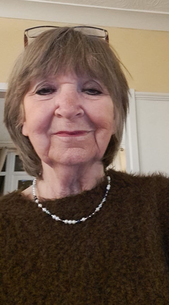 A DesigNA customer wearing her DNA Profile Necklace